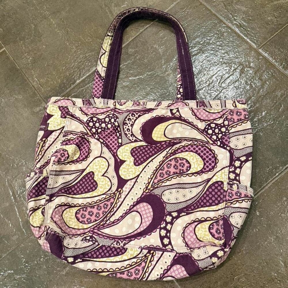 Purple and yellow paisley tote with side pockets and compartment.